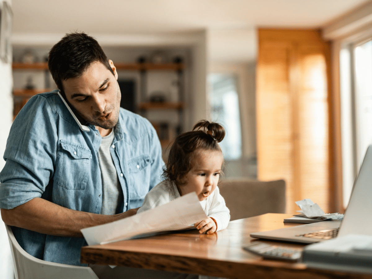 To meet WIC eligibility, a father organizes his paperwork with help from his pediatrician.