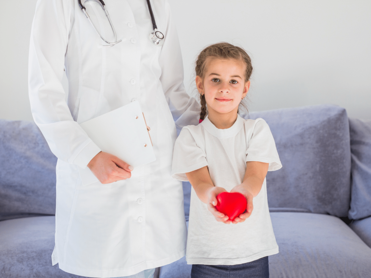 A child discovers more about pediatric heart health with the help of their friendly pediatrician!