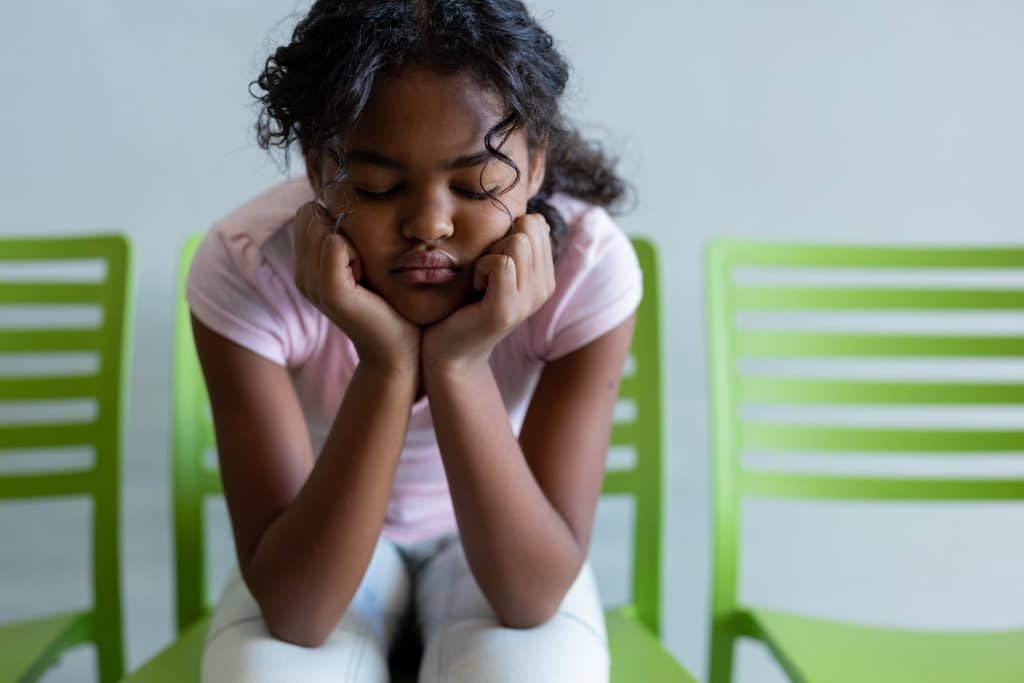 Young girl experiencing childhood stress.