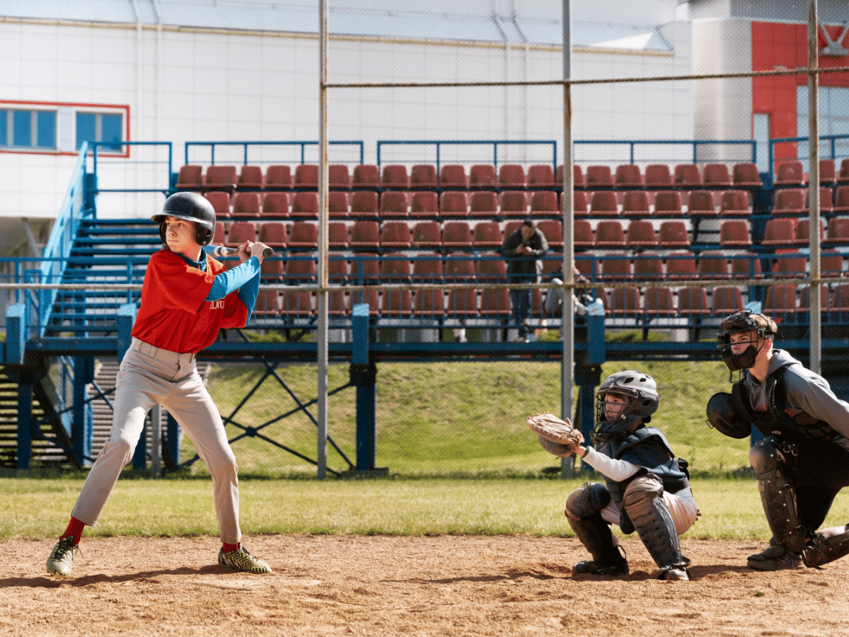 Teens play baseball after their sports physical exam