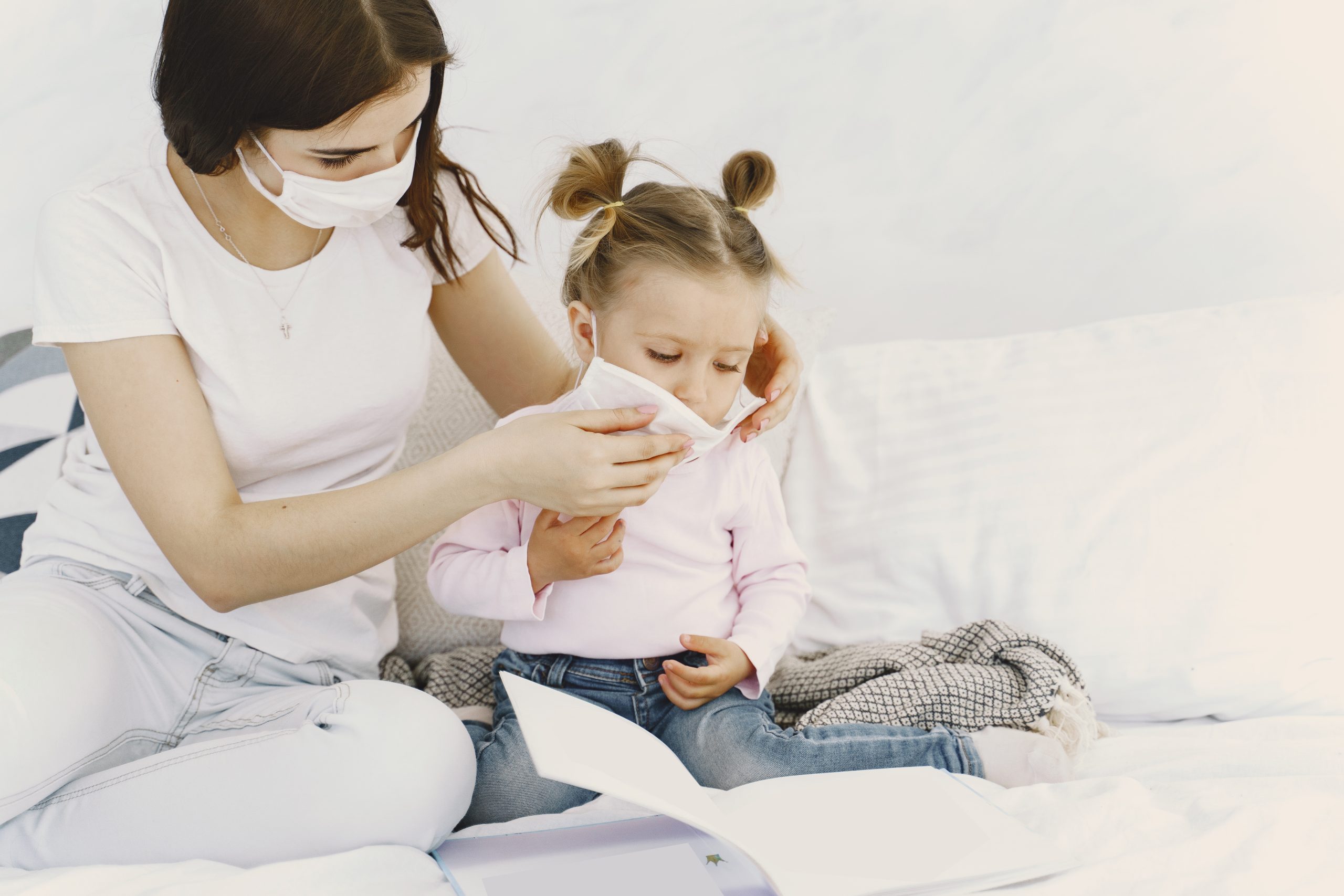 A mother checks her daughter as she starts to show symptoms of pneumonia.