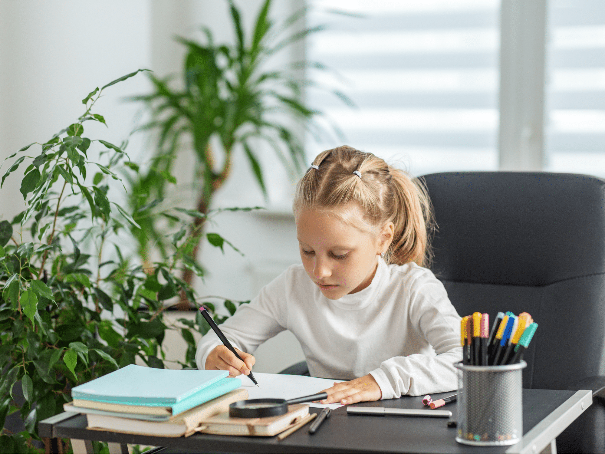 Child focuses on homework after improved indoor air quality with ventilation, reducing pollutants and aiding concentration.